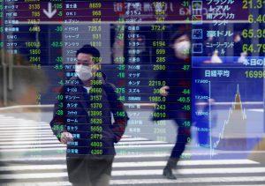 Asian shares slip as economic strains pile up