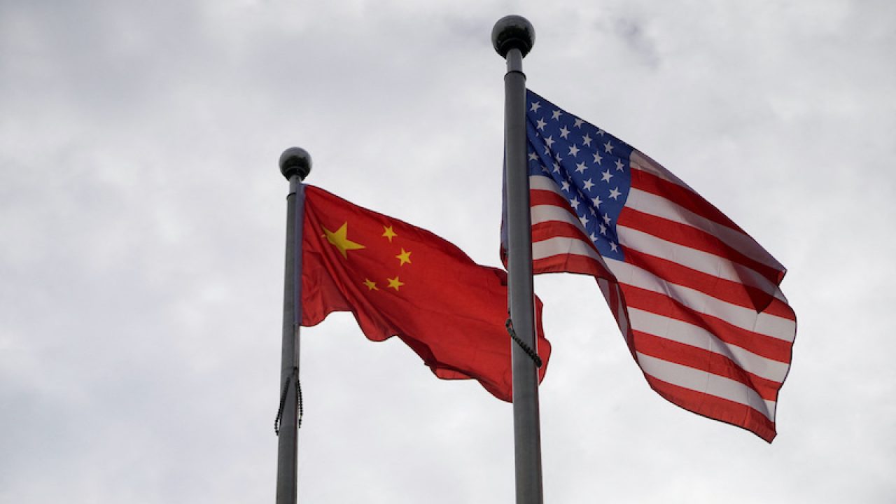 https://www.asiafinancial.com/wp-content/uploads/2022/07/Chinese-and-US-flags-flutter-outside-a-building-in-Shanghai-Nov-16-2021.-RtrsAly-Song-1280x720.jpg
