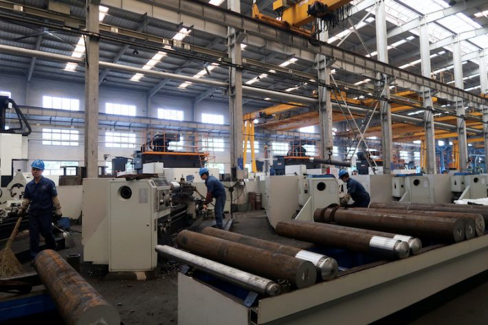 Employees work on the production line at Jingjin filter press factory in Dezhou, Shandong province, China August 25, 2022. REUTERS/Siyi Liu