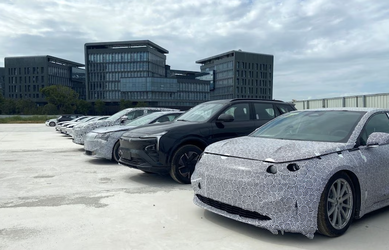 Test cars by Evergrande are parked outside the Evergrande New Energy Vehicle (NEV)'s research center, in Shanghai, China October 6, 2021. Picture taken October 6, 2021. REUTERS/Yilei Sun/File photot