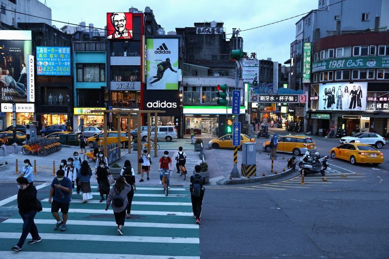 People cross the street in Taoyuan, Taiwan