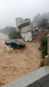 A building collapses due to landslides and floods in Meizhou City, Guangdong, China in this screen grab obtained from a social media video