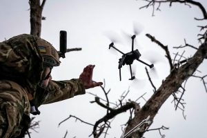 Ukrainian serviceman launches a kamikaze FPV drone at a front line, amid Russia's attack on Ukraine.