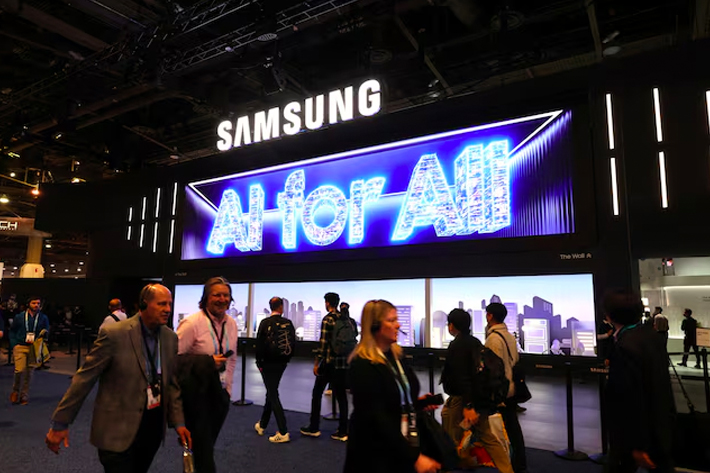 People walk past a Samsung Electronics booth during CES 2024, an annual consumer electronics trade show