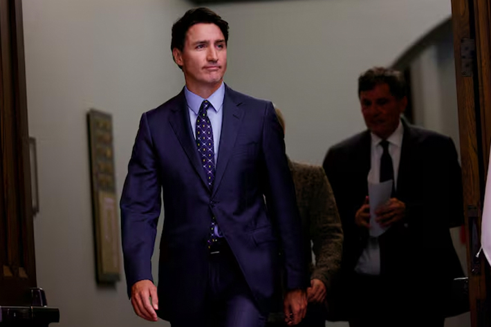 Canada's Prime Minister Justin Trudeau, with Minister of Foreign Affairs Melanie Joly, and Minister of Public Safety, Democratic Institutions and Intergovernmental Affairs Dominic LeBlanc, arrives to a press conference about the Royal Canadian Mounted Police's investigation into "violent criminal activity in Canada with connections to India.