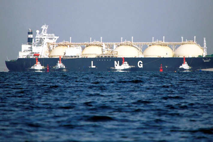 A liquefied natural gas (LNG) tanker is tugged towards a thermal power station in Futtsu, east of Tokyo.