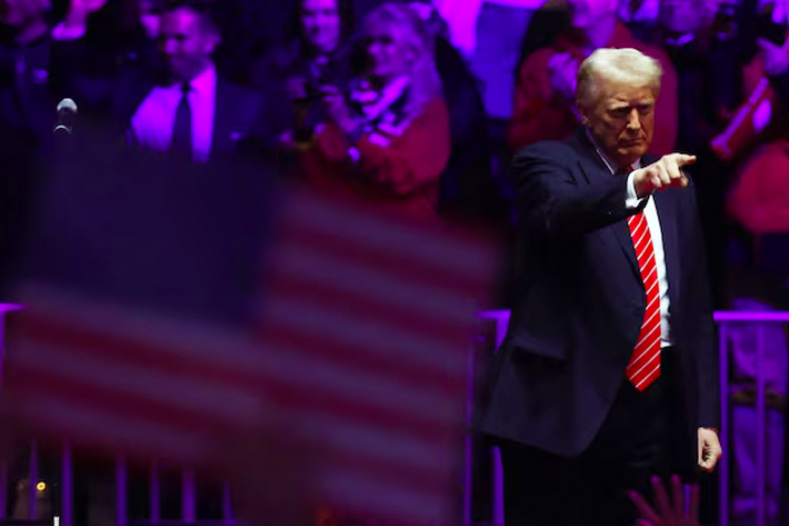 U.S. President-elect Donald Trump gestures during a rally the day before he is scheduled to be inaugurated for a second term, in Washington.