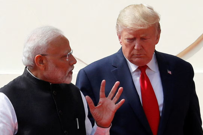 US President Donald Trump and India's Prime Minister Narendra Modi talk as they arrive for a joint news conference after bilateral talks at Hyderabad House in New Delhi, India