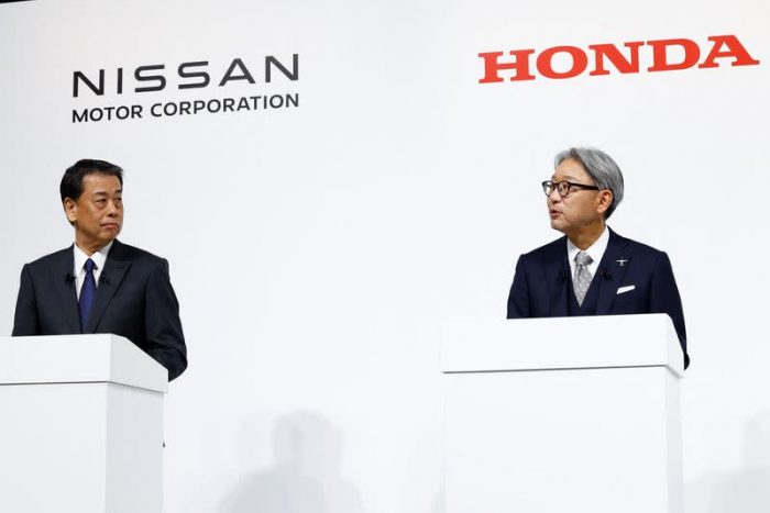 Nissan CEO Makoto Uchida, left, is seen with Toshihiro Mibe, CEO of Honda in December 2024, when they revealed their were having merger talks